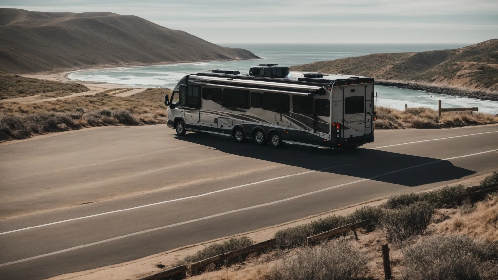 an rv parked at a scenic overlook with san diego's expansive coast stretching into the distance.